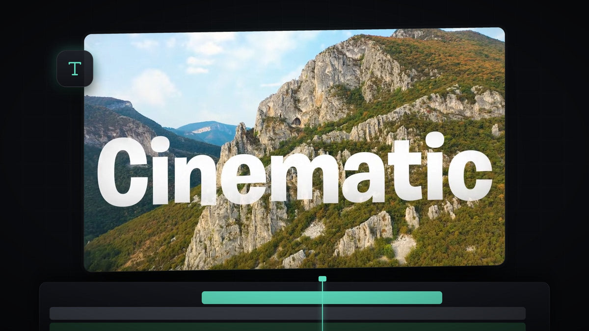 The word Cinematic in large white letters over a mountain landscape, made with a cinematic text fade in Premiere Pro