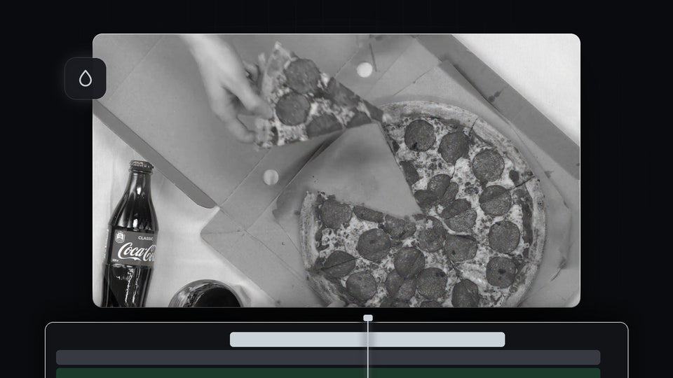 Black and white overhead shot of a pepperoni pizza and a cola bottle graded in Premiere Pro