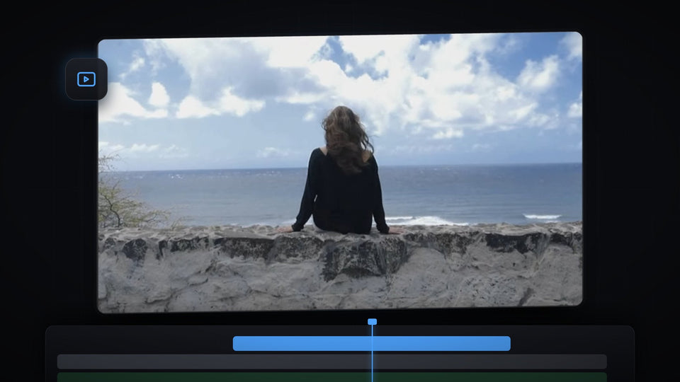 A cropped video of a woman sitting by the ocean, an example of cropping a video clip in Premiere Pro