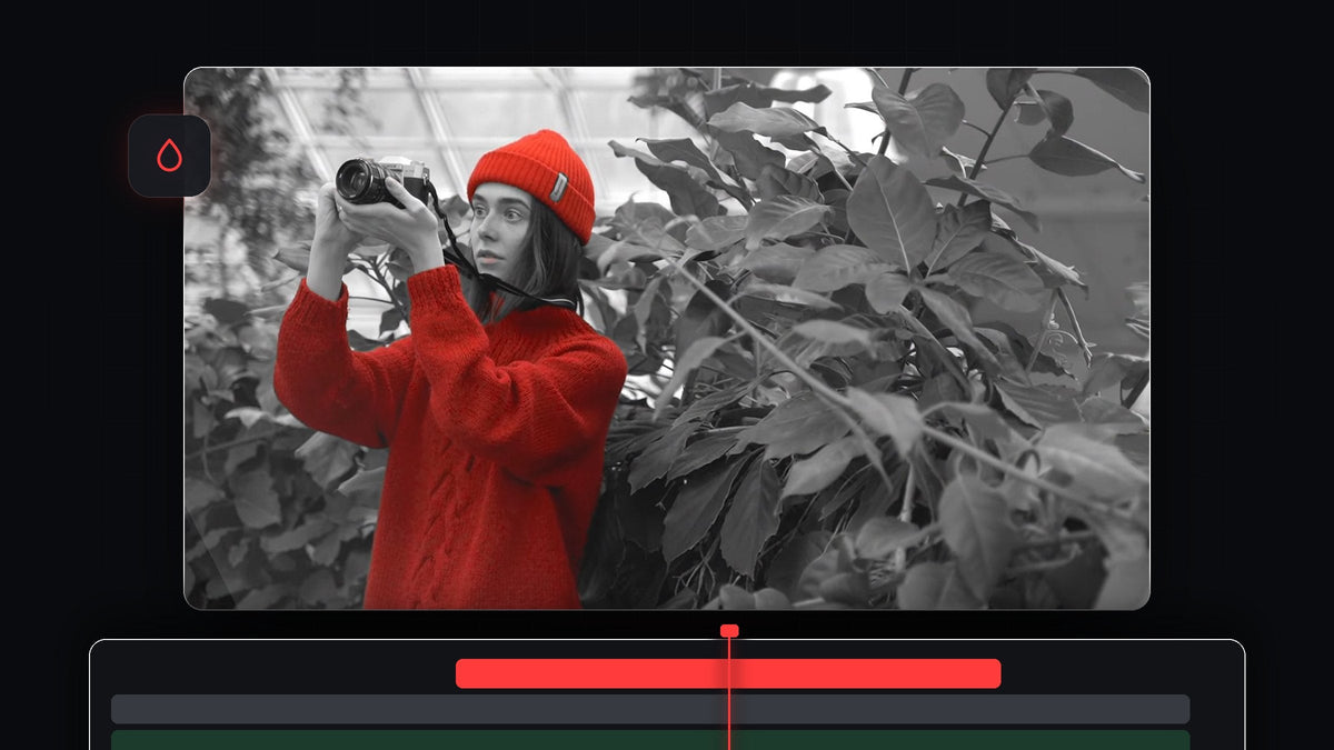 A woman in a red sweater and hat in color against black and white green plants, showing the isolated color effect in Premiere Pro