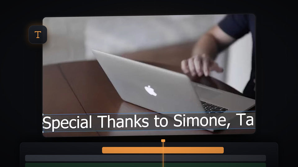 Premiere Pro Program Monitor with white crawl text on a dark bar along the bottom of a laptop clip